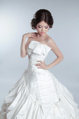 Fototapeta na wymiar Bridal makeup, hairstyle. Beautiful charming bride in wedding lu