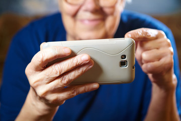 Elderly woman with tablet computer