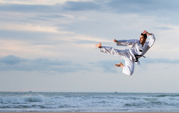 Man jumping to practice Marcial Arts kick