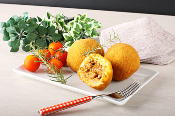 Arancini, rice balls with meat and sauce