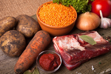 Ingredients for Turkey vegetable soup with red lentils, lying on