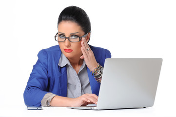 nervous and sad young business woman at the desk with a laptop