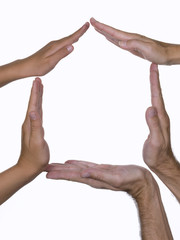 Hands of different ages, forming the outline of a house