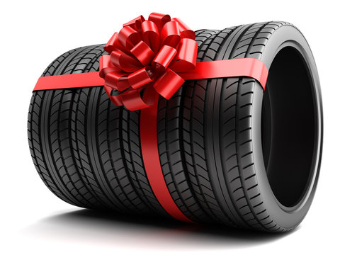 Gift set of tires wrapped ribbon and bow isolated