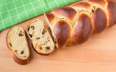 Braided bread with fruits and nuts.