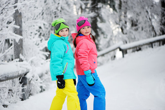 Two kid girls in winter park