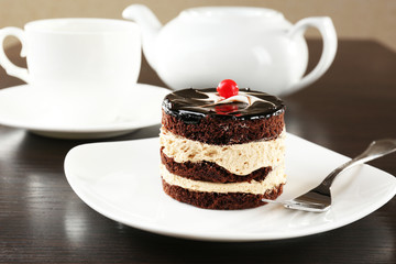 Yummy chocolate cupcake on table, close-up