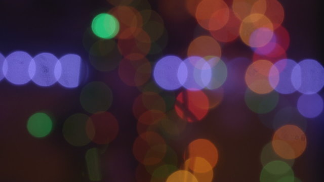 Christmas holidays lights blinking out of focus background