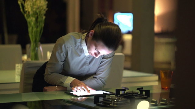 Pretty businesswoman working on tablet computer