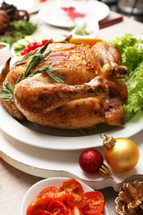 Baked chicken for festive dinner. Christmas table setting