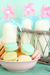 Gentle colorful macaroons and milk bottles