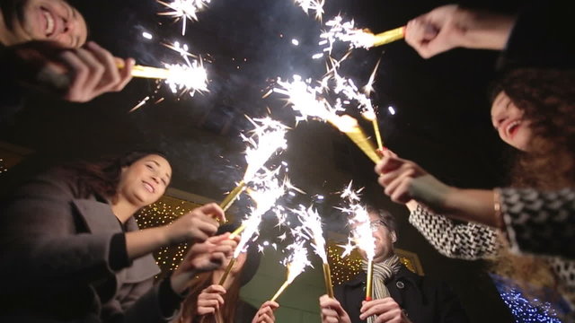 SLOW MOTION: Friends with sparklers dancing