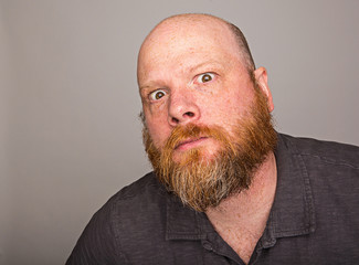 bald man with full red beard