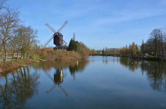 windmill reflected on the water surface