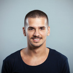 Obraz premium Portrait of a smiling young man. Studio Shot