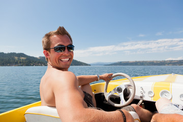 Smiling Man on Speedboat