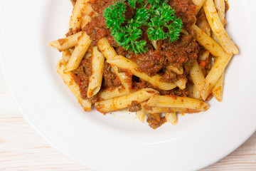 Penne pasta with a tomato bolognese beef sauce