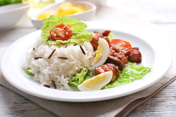 Boiled rice served on table, close-up