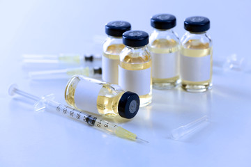 Vaccine in vial with syringe