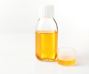 Cough syrup isolated on white