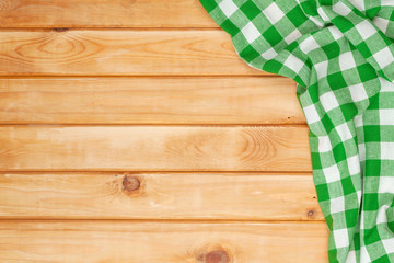 Green towel over wooden kitchen table