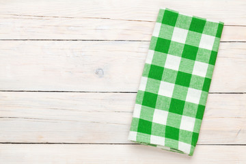 Green towel over wooden kitchen table