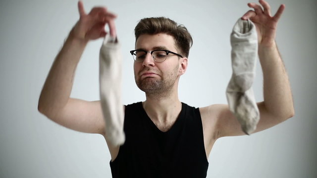 Man is smelling his socks