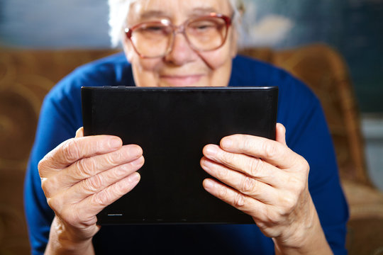 Elderly Woman With Tablet Computer