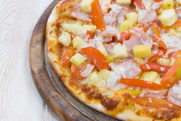 Hawaiian Pizza on wood table