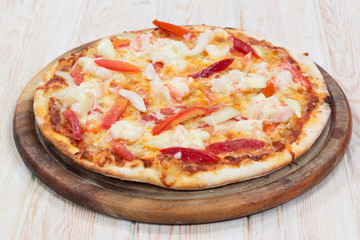 Delicious shrimp pizza on wood