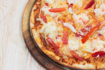 Delicious shrimp pizza on wood