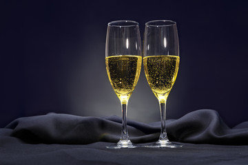 Two glasses of champange on dark background