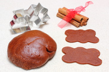 Gingerbread dough for Christmas cookies and cinnamon sticks