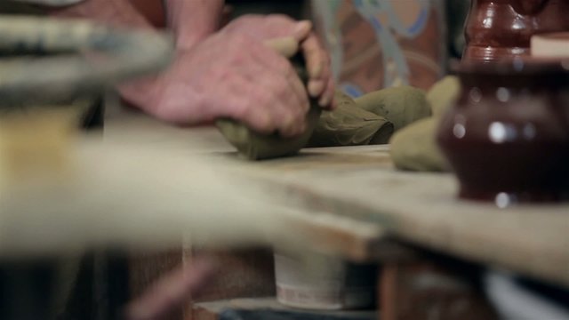 Preparing for molding a piece of clay