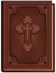 The Bible. Closed book with a cross on the cover
