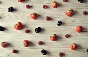 Naklejka na ściany i meble Aerial photo of raspberries, strawberries and blackberries