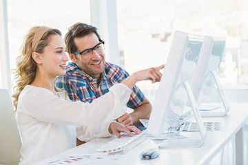 Smiling photo editors using computer