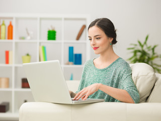 woman browsing the internet on laptop