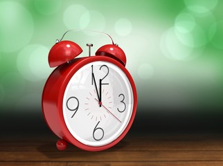 Composite image of alarm clock counting down to twelve