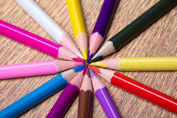 Naklejka premium close up of colour drawing pencils on wooden table