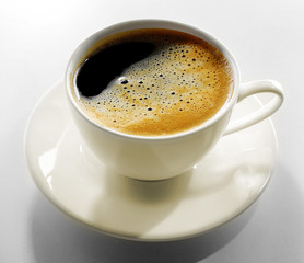 Cup of coffee on grey table