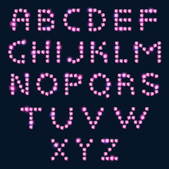 Pink diamond letters alphabet on dark background.