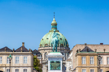 Fototapeta na wymiar Castle Amalienborg with statue of Frederick V in Copenhagen,
