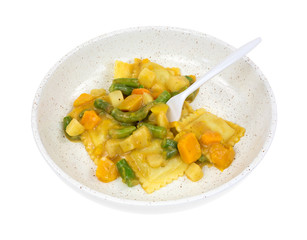 Ravioli and vegetable meal with fork