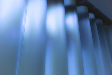 Abstract light and shadow. Modern architectural blue columns. Composition, contemporary, geometry, perspective, minimalism, design, elegance, simplicity, conceptual, futuristic