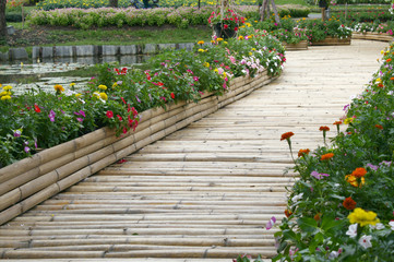 bamboo bridge with flower on the pond