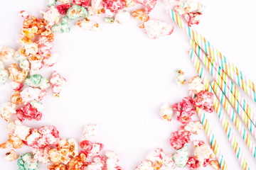 popcorn and drinking straws with space