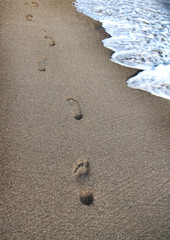 Footprints on the beach sand