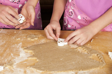 Making homemade christmas cookies in various shapes