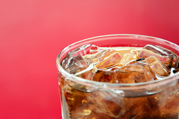 A glass of cola soft drink with ice cubes